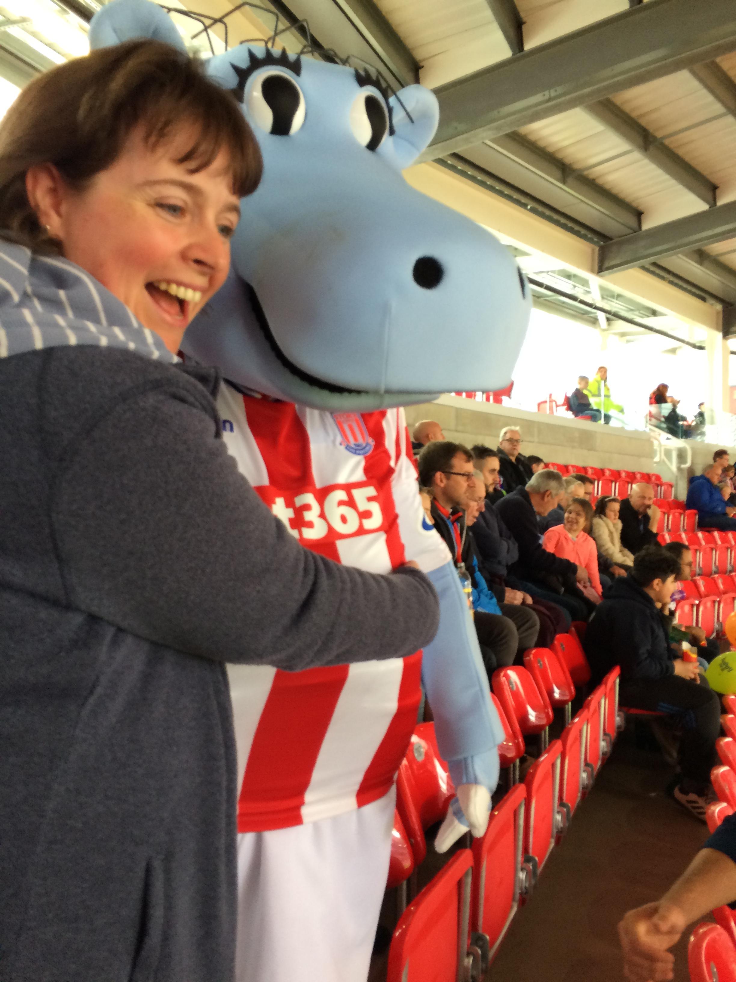 Stoke City FC mascot, Pottermus, and an over enthusiastic Abi Brown