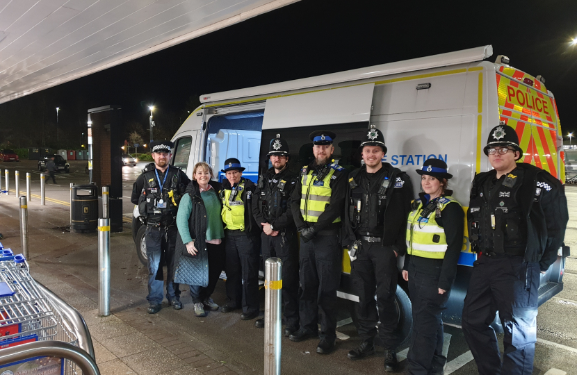 Abi Brown with local police officers outside the mobile police station