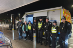 Abi Brown with local police officers outside the mobile police station