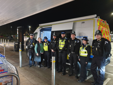 Abi Brown with local police officers outside the mobile police station